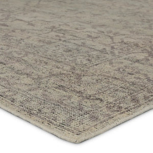 hand knotted wool rug
heirloom craftsmanship rug
vintage inspired rug
abrashed pattern
washed medallion design rug
gray and cream rug
subtle black accents
timeless elegant rug
sophisticated home decor rug
durable artisan rug