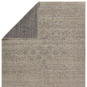 hand knotted wool rug
heirloom craftsmanship rug
vintage inspired rug
abrashed pattern
washed medallion design rug
gray and cream rug
subtle black accents
timeless elegant rug
sophisticated home decor rug
durable artisan rug